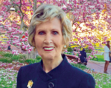 Photo portrait of The Honorable Connie Morella in front of the cherry blossoms in Washington, DC